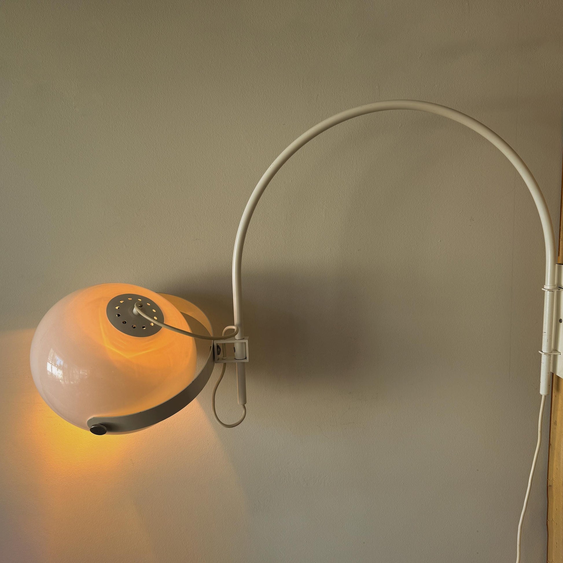 Mid-Century Space Age mushroom wall lamp by Dijkstra with white rounded shade and curved arm.
