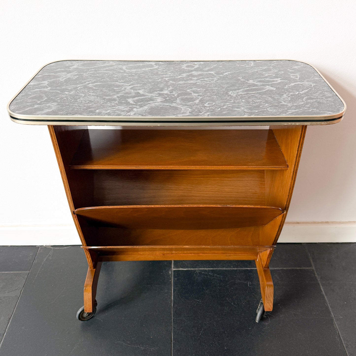 Mid-Century Modern bar cart, wood and marble-effect laminate, mid-20th century.