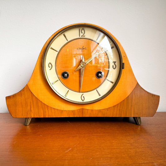 Mid-Century Modern Orfac pendulum table chimney clock with wood case and brass details.