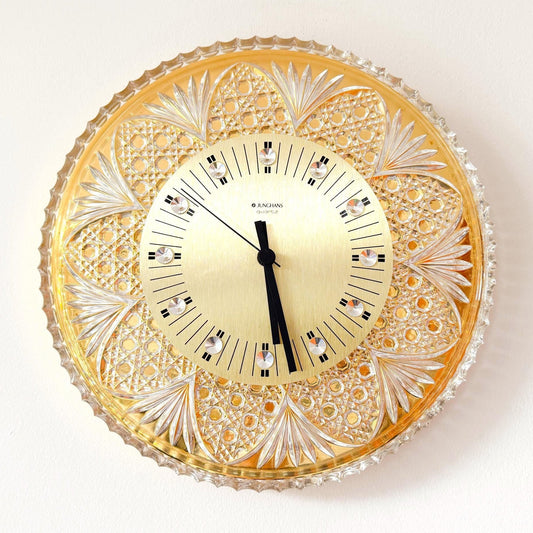 Mid-Century Modern Junghans & Joska Waldglashütte wall clock with crystal glass and gold-plated metal.