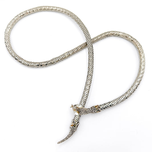 Vintage snake mesh necklace, silver-tone metal, sculptural serpent form with rhinestone eyes.