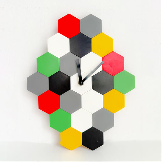 Vintage IKEA SMYCKE modular puzzle wall clock in Memphis-style design by Marcus Arvonen, multicolor hexagon tiles