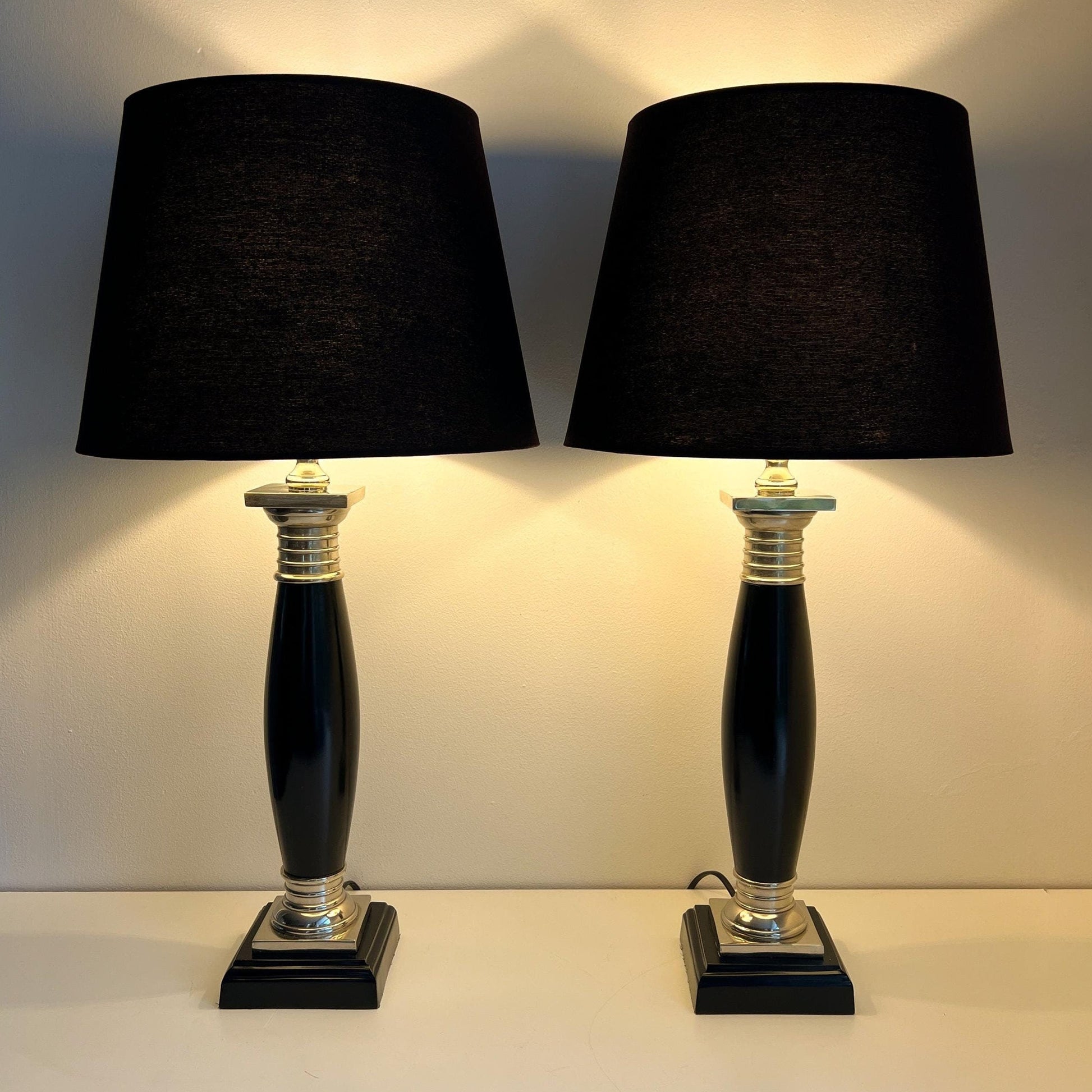 Hollywood Regency Empire style table lamps by Colmore, metal with black and silver column.