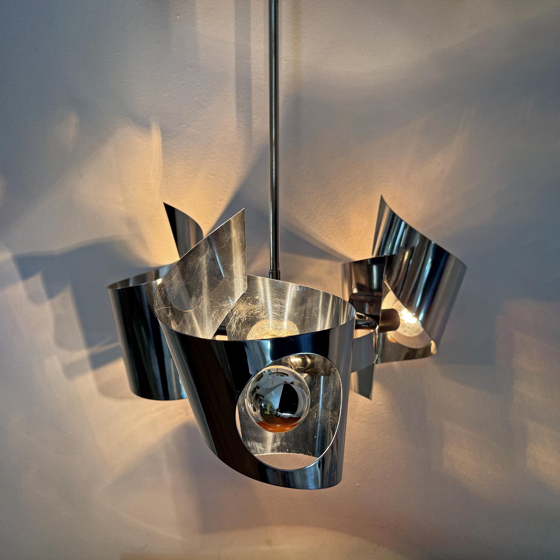 Mid-Century Modern Space Age chrome pendant lamp with three tubular elements, European vintage design.