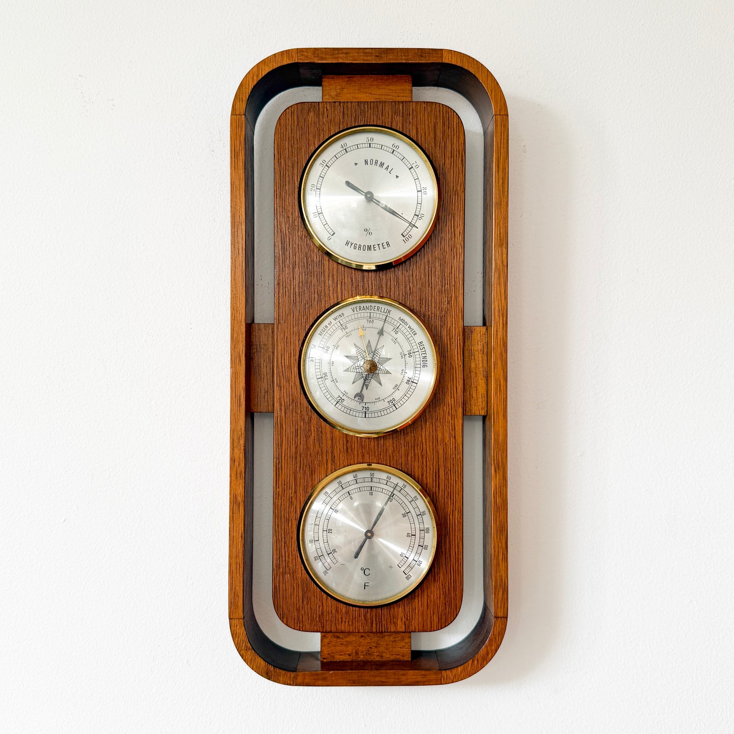 Mid-century Scandinavian modern wall weather station in teak with brass instruments. By Vintagefindsbyrenata