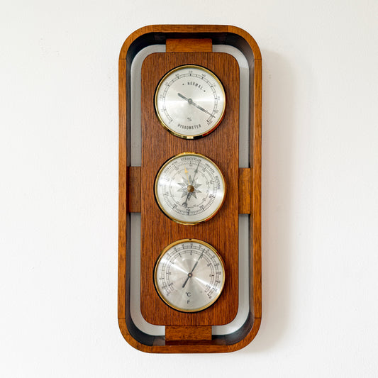 Mid-century Scandinavian modern wall weather station in teak with brass instruments. By Vintagefindsbyrenata