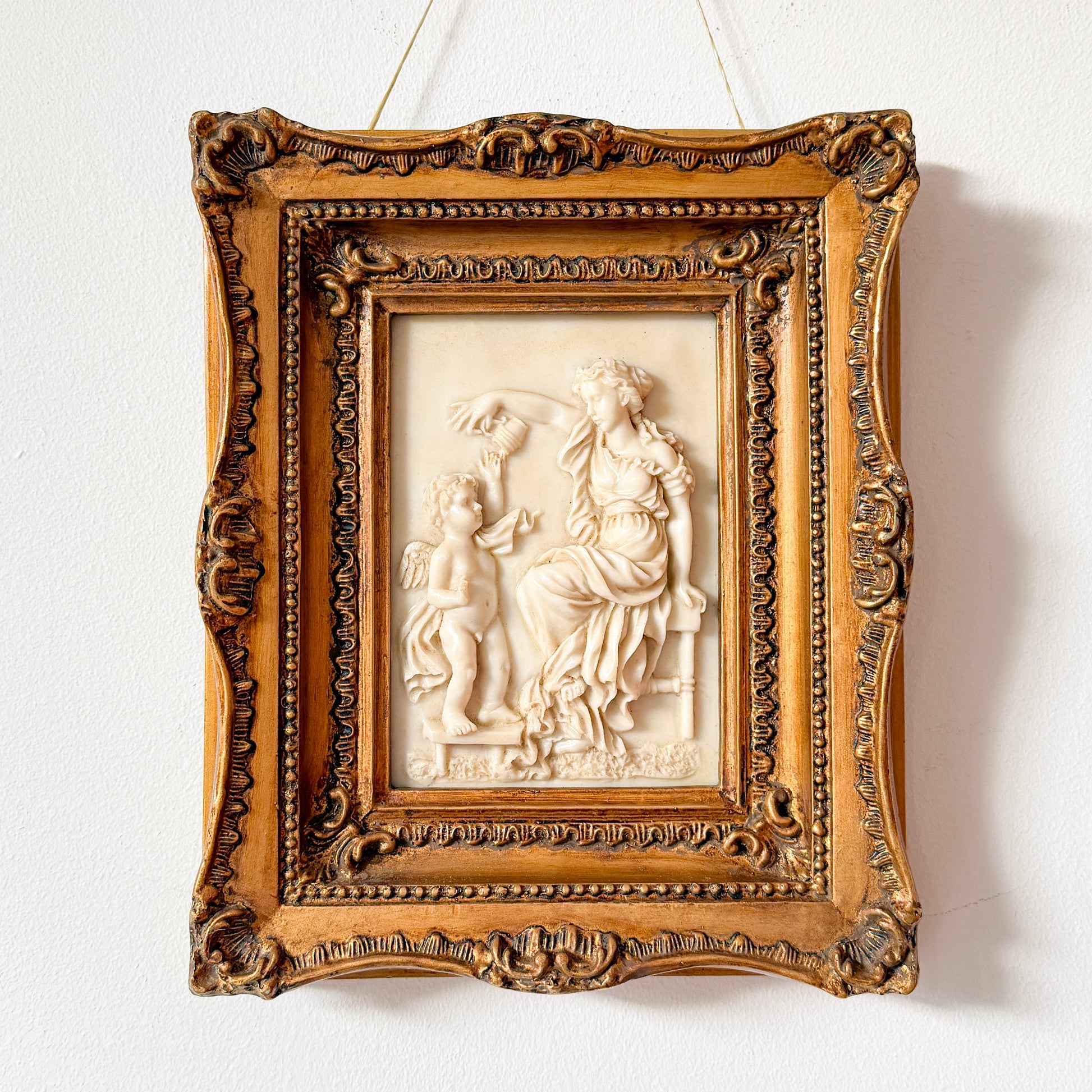 Classical figural relief wall plaque, alabaster-style relief with gilded Rococo Revival frame. By Vintagefindsbyrenata