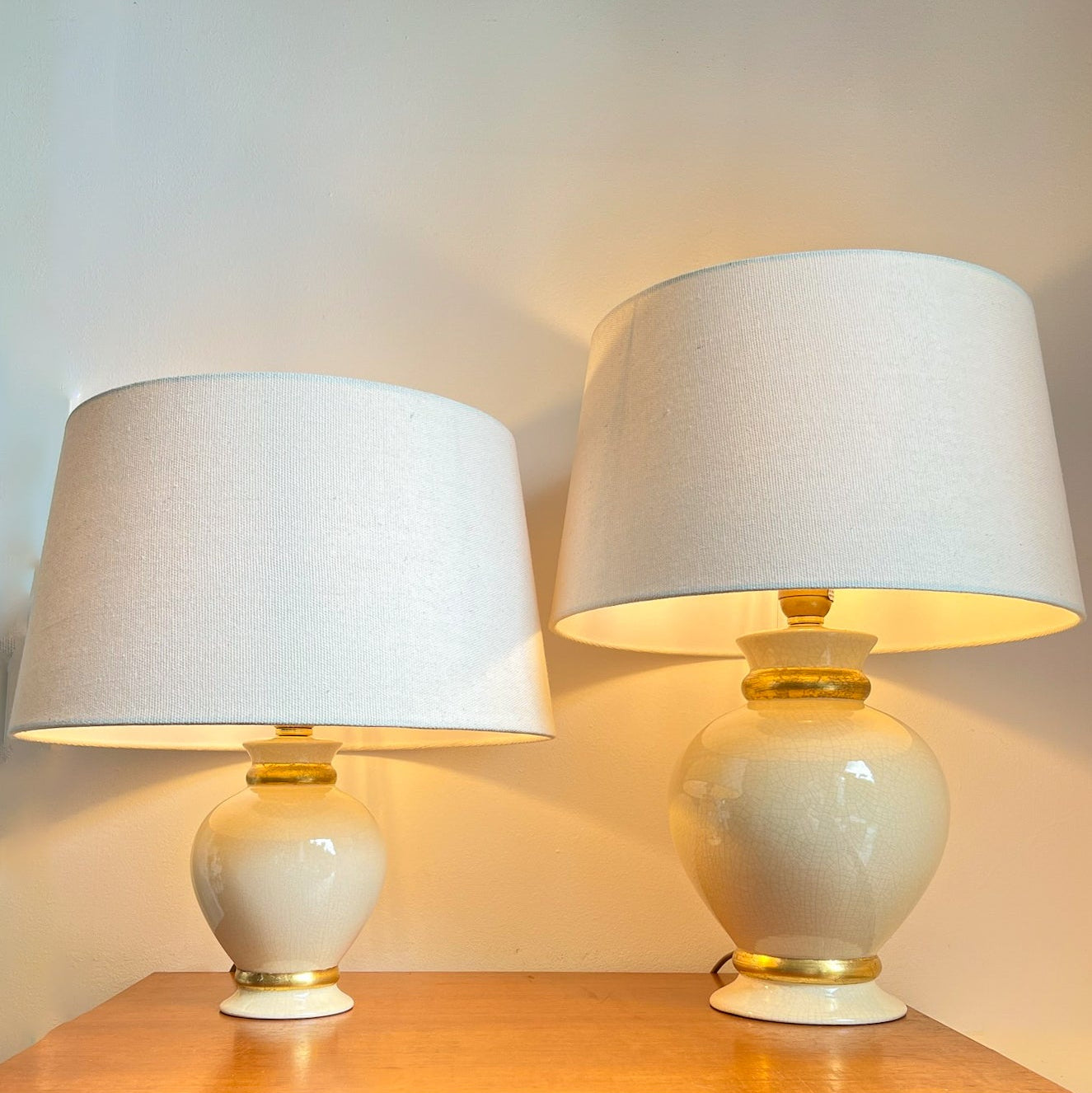 Vintage French ceramic crackle table lamps by Maison Le Dauphin, ivory with gold accents, 1970s.