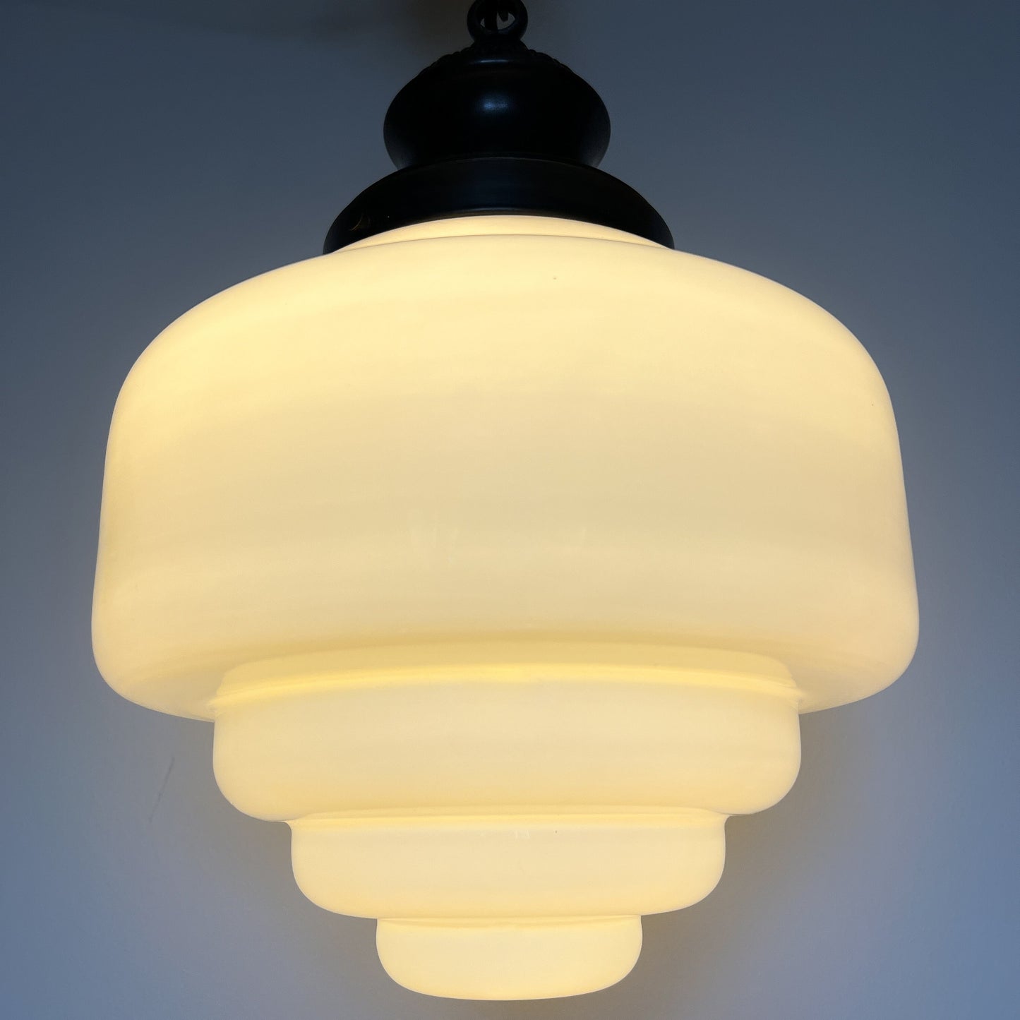 Art Deco opaline glass pendant lamp with brass chain and ceiling rosette.