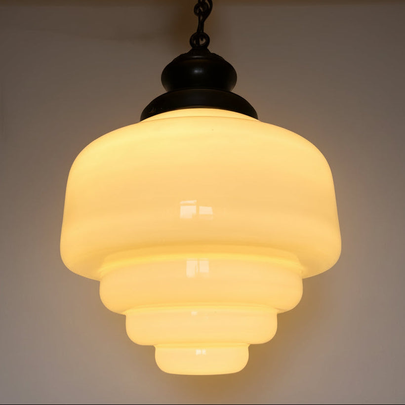 Art Deco opaline glass pendant lamp with brass chain and ceiling rosette.