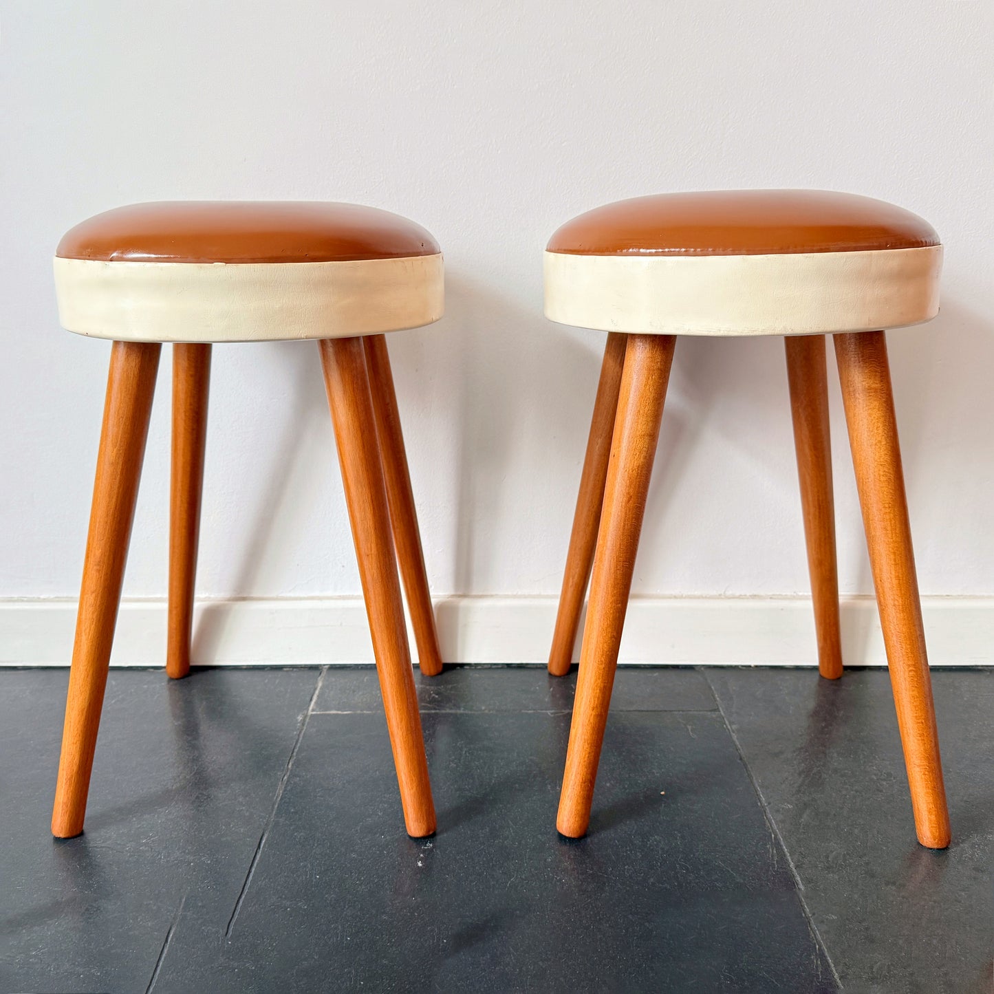 Mid-century wooden stool with brown and cream leather seat. By vintagefindsbyrenata