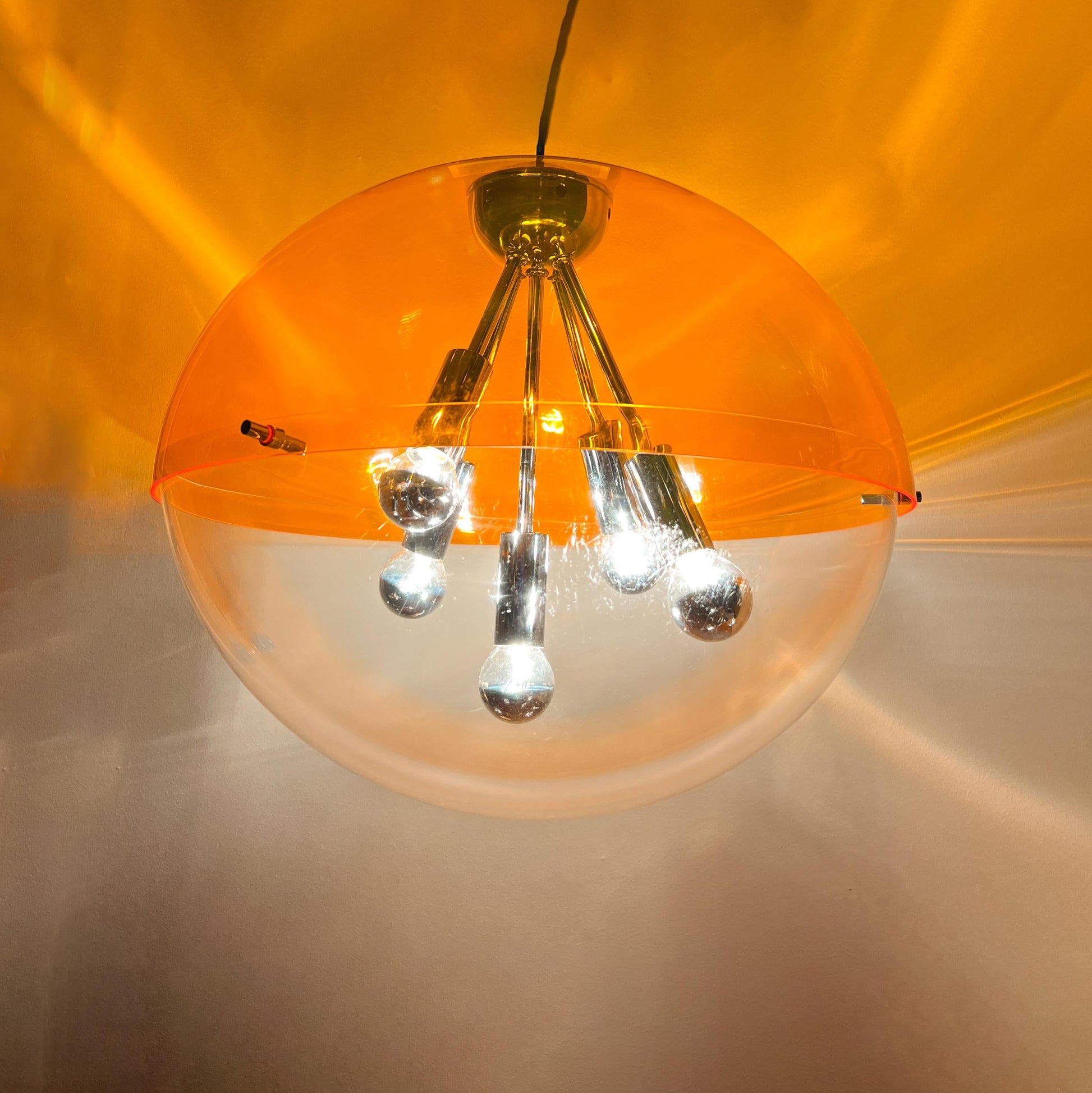 Vintage RAAK Amsterdam Sphere XL pendant lamp with orange transparent globe and chrome fittings, mid-century Space Age design
 By Vintagefindsbyrenata