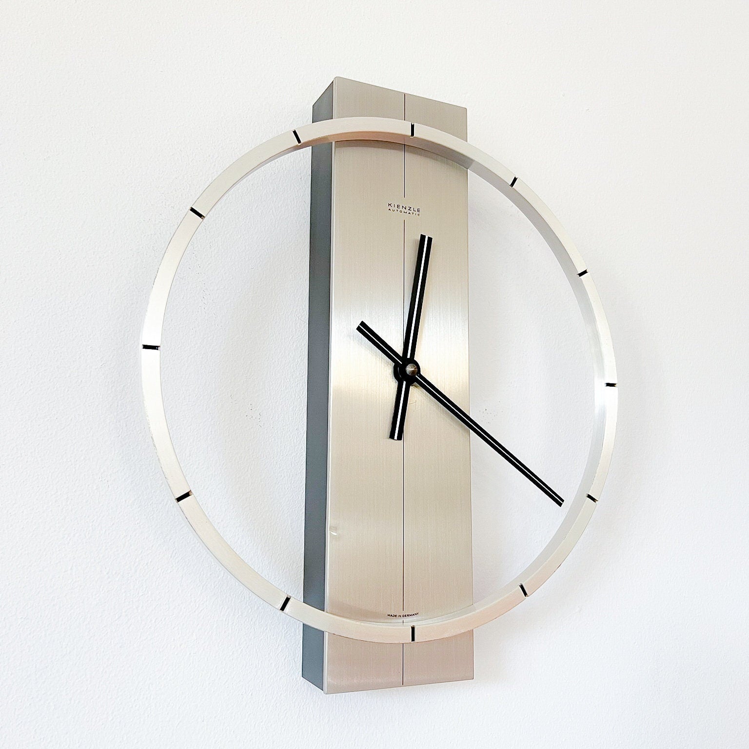 Mid-Century Modern wall clock by Kienzle, nickeled metal, German vintage.